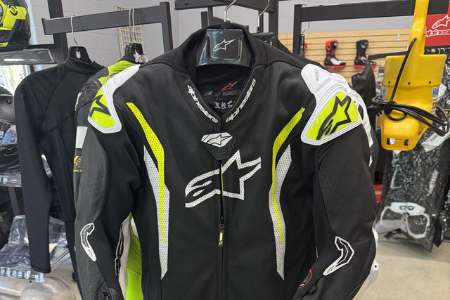 Alpinestars one-piece leather race suit on a hanger at Indy Superbikes